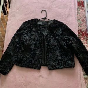 A black faux fur cropped jacket